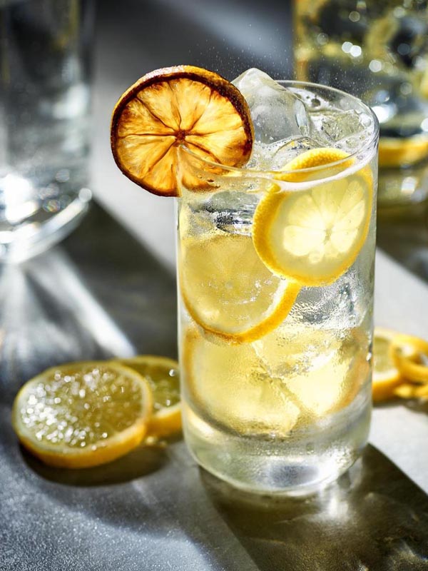 A quneching glass of lemon vodka